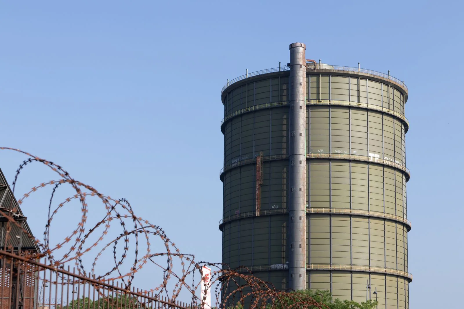 A large industrial gas holder tank of the kind that captures biogas from anaerobic digestion.